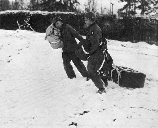 101st Airborne troops retrieving air dropped supplies during the siege of Bastogne.