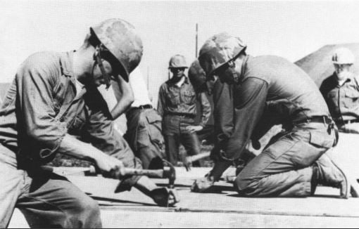 Builders fabricating a Strongback tent during a training exercise at Port Hueneme, 1969. (USN)