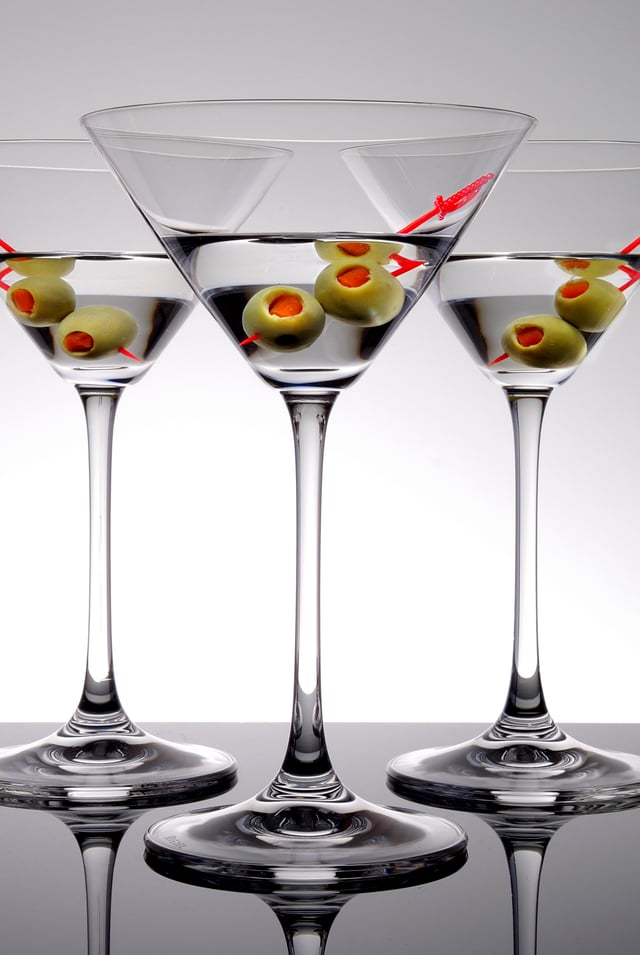 Three martinis with olives as a garnish