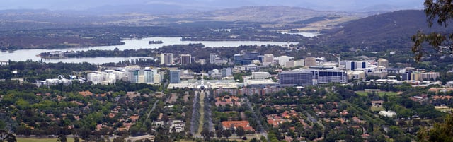 Canberra Civic viewed from Mount Ainslie with Lake Burley Griffin and Mount Stromlo in the background.