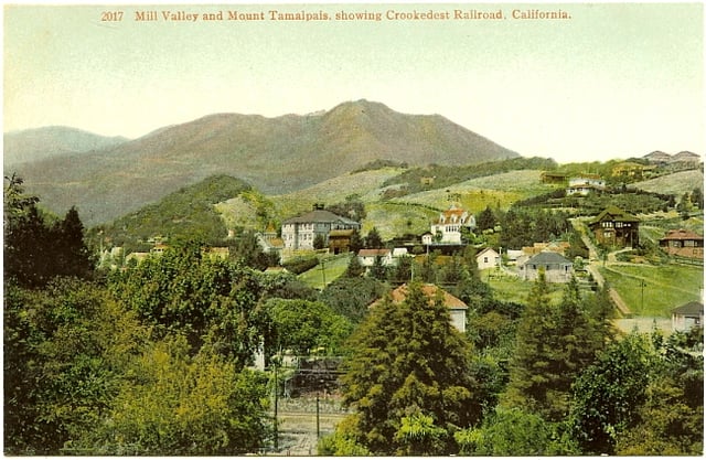 Similar view of Mill Valley, circa 1910, as pictured on a souvenir postcard with the caption 'Mill Valley and Mount Tamalpais, Showing Crookedest Railroad, California'.
