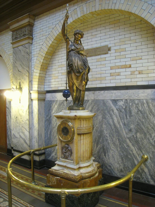 Monumental conical pendulum clock by Eugène Farcot, sculpture by Albert-Ernest Carrier-Belleuse. Donated in 1912 to the University. Main building, great court.