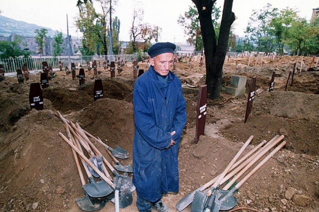 A grave digger at a cemetery in Sarajevo, 1992