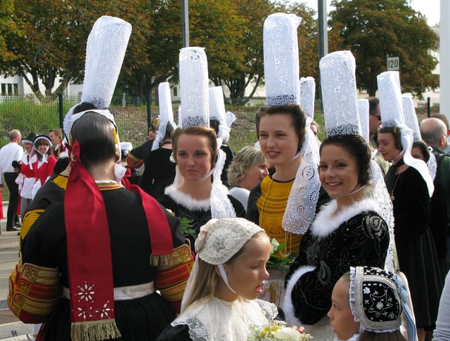 Breton women wearing the Bigouden distinctive headdress, one of the symbols of Breton identity.