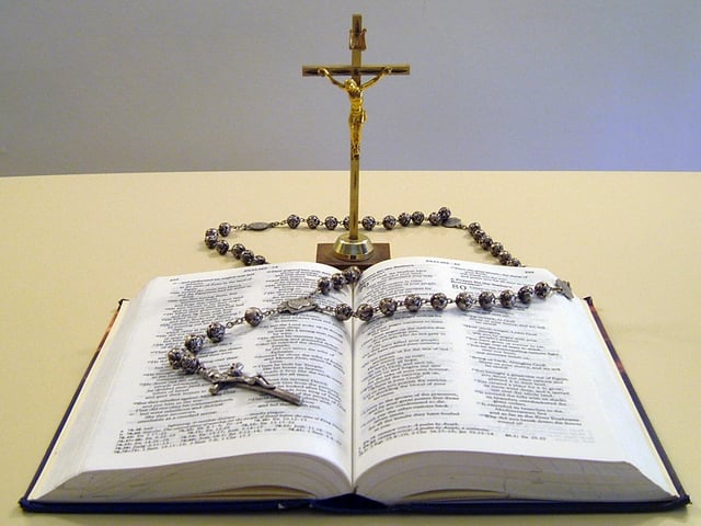 Samples of Catholic religious objects – the Bible, a crucifix and a rosary
