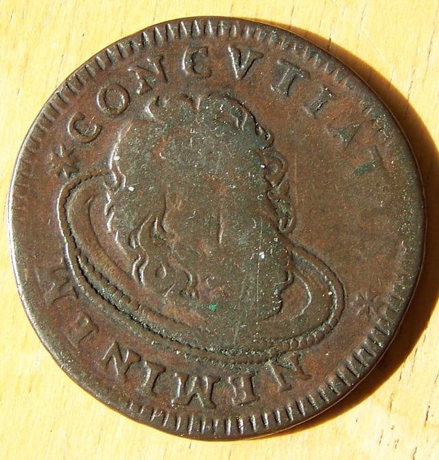 A 1742 Tarì coin of the Knights Hospitaller, depicting the head of John the Baptist on a platter.
