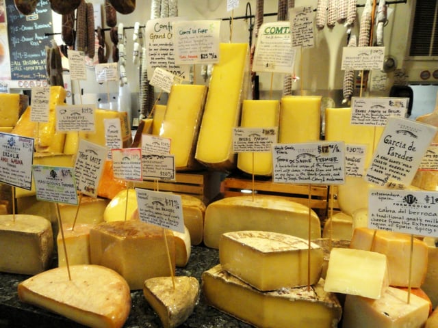 Cheese display in grocery store, Cambridge, Massachusetts, United States.