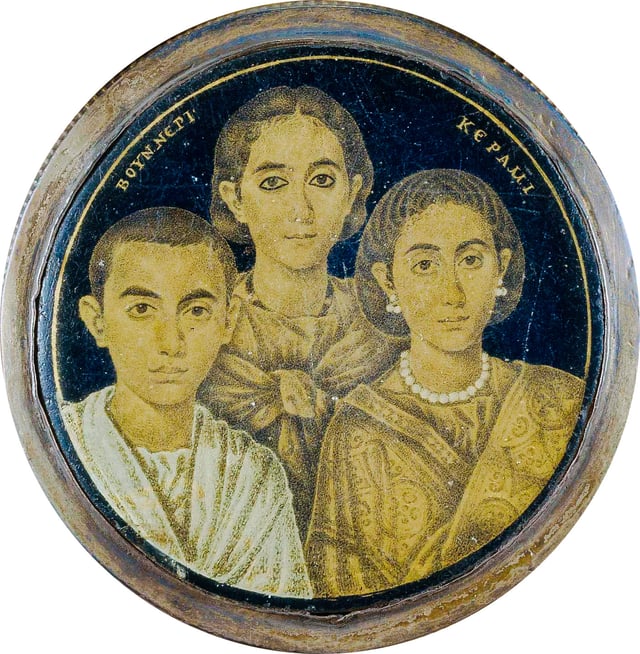 A gold glass portrait of a family from Roman Egypt. The Greek inscription on the medallion may indicate either the name of the artist or the pater familias who is absent in the portrait.