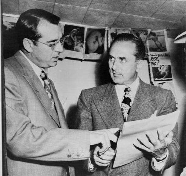 John Roselli (right) checks over a writ of habeas corpus with his lawyer, Frank DeSimone after Roselli surrendered to U.S. Marshals in 1948.