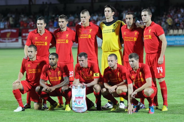 Liverpool F.C. team photo prior to their UEFA Europa League clash against FC Gomel. Note the differing attire of goalkeeper Brad Jones with that of the rest of his teammates.