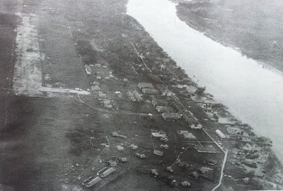 Aerial view of Bintulu town in 1950s. Bintulu airstrip can be seen at the top left corner of the image.