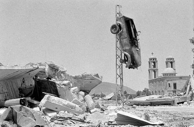 Quneitra village after Israeli shelling, showing a church and an elevated car