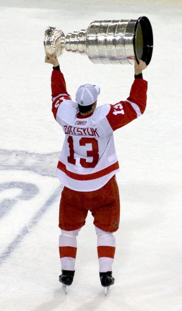 After winning the Cup, players traditionally skate around holding the trophy above their heads, as Pavel Datsyuk of the Detroit Red Wings does here when the Red Wings captured their 11th cup in 2008