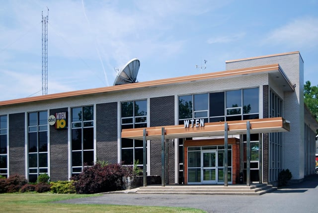 WTEN (headquarters pictured), WXXA, and Spectrum News broadcast from within city limits.