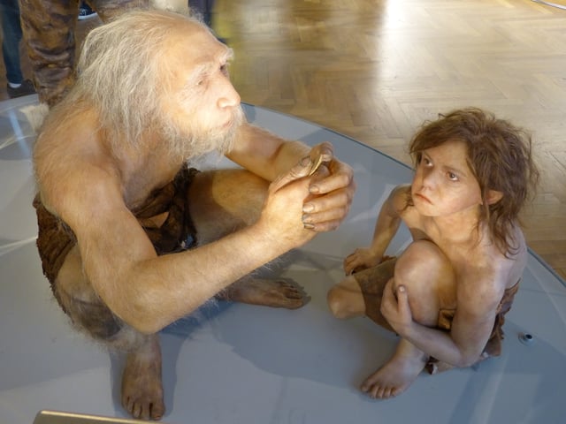 Artist's reconstruction of a Neanderthal man with child
