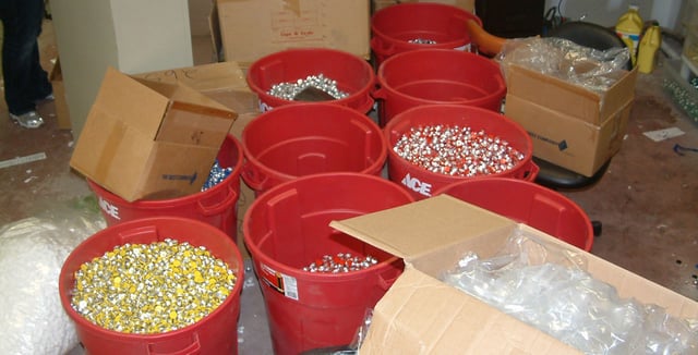 Several large buckets containing tens of thousands of AAS vials confiscated by the DEA during Operation Raw Deal in 2007.