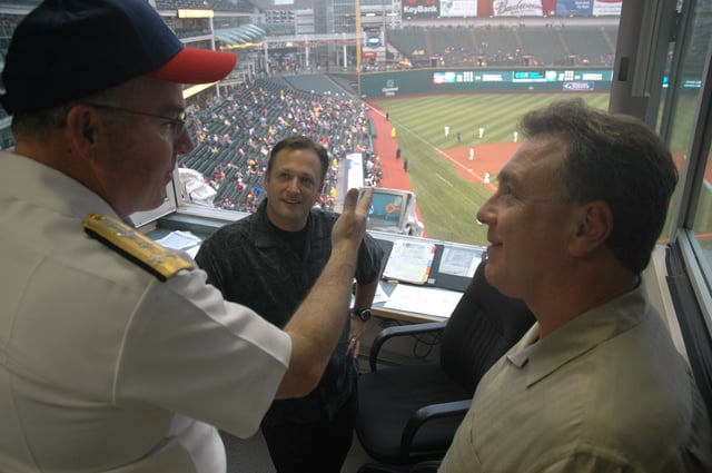 Indians TV announcer Matt Underwood (seated, center) and longtime lead radio announcer Tom Hamilton (right)