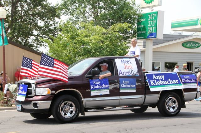 Amy Klobuchar's father, Jim, and supporters campaigning for Klobuchar as U.S. Senator, Tower, Minnesota, July 4, 2012