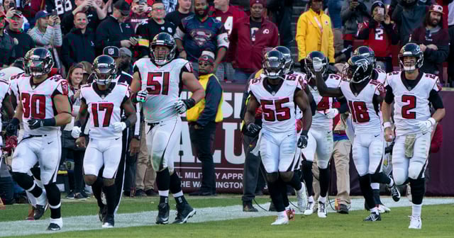 Ryan and his teammates in a game against the Washington Redskins