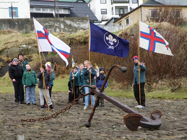 Members of KFUM Skótarnir I Føroyum flying the national flag on Grækarismessa (12 March)