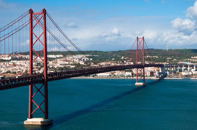 The 25 de Abril Bridge crosses the Tagus River from Alcântara to Almada.