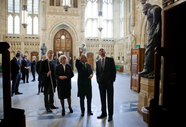 US President Barack Obama (right) in the Members' Lobby during a tour of the Palace in May 2011. With him are, from the left: the Lord Great Chamberlain, the Marquess of Cholmondeley, holding his white staff of office; the Lord Speaker, Baroness Hayman; and the Speaker of the House of Commons, John Bercow.