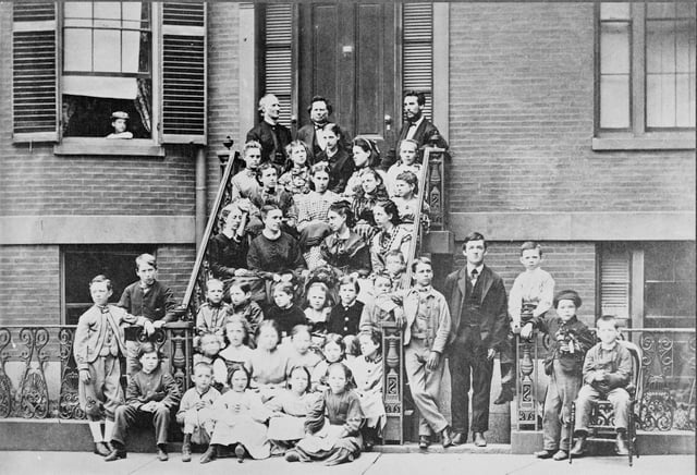 Bell, top right, providing pedagogical instruction to teachers at the Boston School for Deaf Mutes, 1871. Throughout his life, he referred to himself as "a teacher of the deaf".