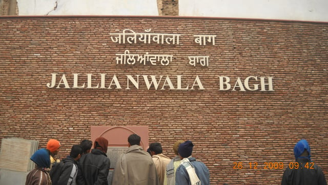 "Jallianwala Bagh" written in Hindi, Punjabi, and English in Amritsar, India.