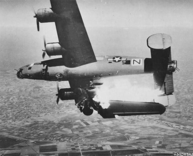 A USAAF B-24 hit by flak over Italy, 10 April 1945.