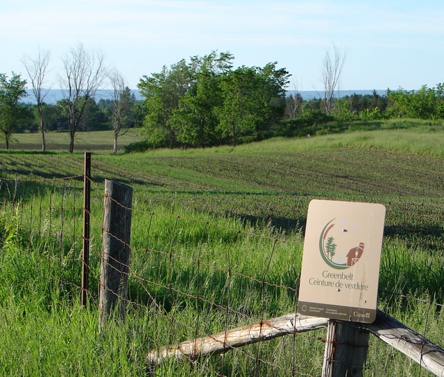 A sign that marks the Ottawa Greenbelt, an initiative that aims to protect the surrounding farmland, and limit urban sprawl