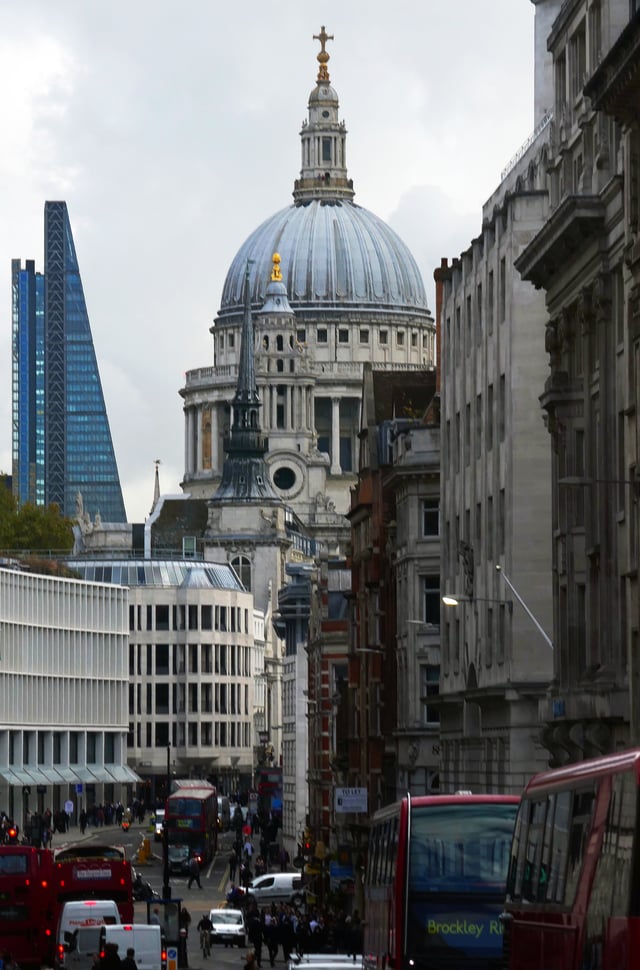 The dome and northwest tower from Ludgate Hill, showing the densely developed area in which St. Paul's is located.