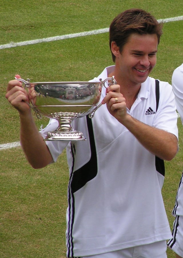 Todd Woodbridge holding the Gentlemen's Doubles silver challenge cup in 2004