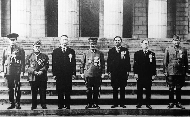 Japan's Prime Minister Hideki Tojo (center) with fellow government representatives of the Greater East Asia Co-Prosperity Sphere. To the left of Tojo, from left to right: Ba Maw from Burma, Zhang Jinghui, Wang Jingwei from China. To the right of Tojo, from left to right, Wan Waithayakon from Thailand, José P. Laurel from the Philippines, and Subhas Chandra Bose from India