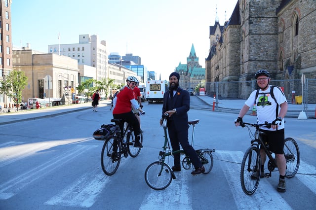 Singh riding a bike at the National Bike Summit in Ottawa in 2018