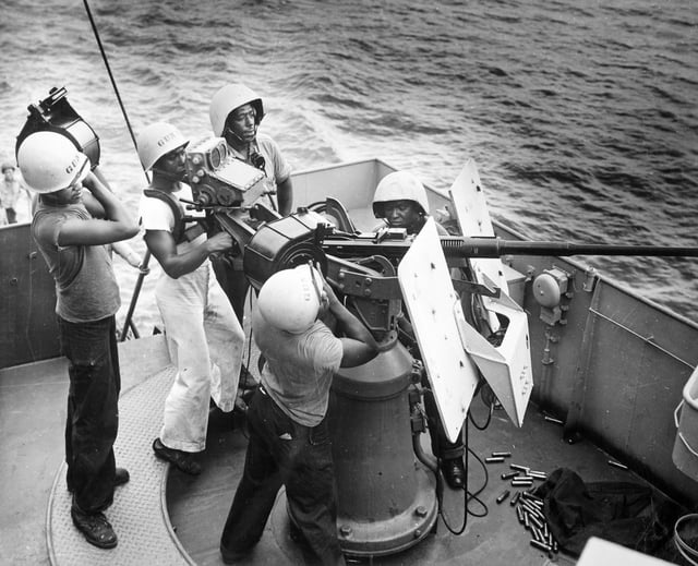 US Coast Guardsmen in the South Pacific man a 20 mm anti-aircraft cannon.