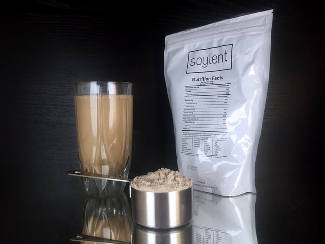 A Soylent package, along with the powder and resulting drink