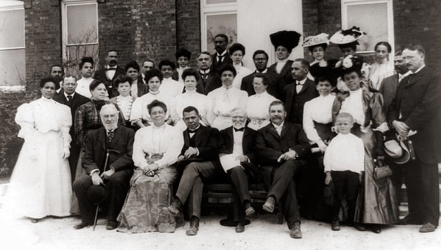 Carnegie with African-American leader Booker T. Washington (front row, center) in 1906 while visiting Tuskegee Institute
