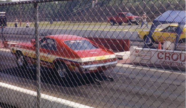 Two AMX dragsters taking off