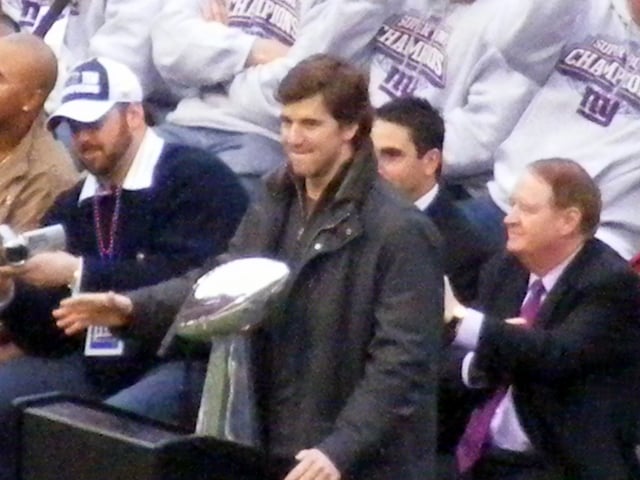 Manning with the Lombardi Trophy during the Giants Super Bowl victory rally at Giants Stadium