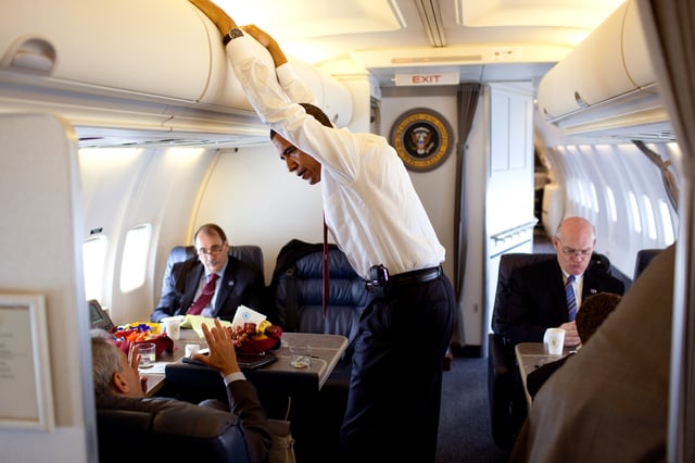 President Obama with his BlackBerry in its holster on a flight to Caen, Normandy, France, June 5th 2009.