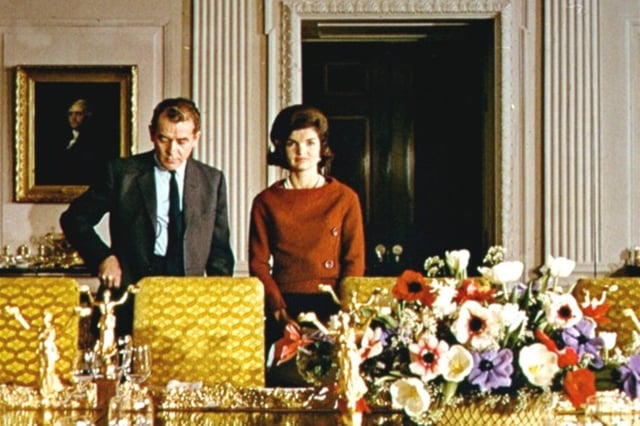 Kennedy with Charles Collingwood during their televised tour of the restored White House in 1962.