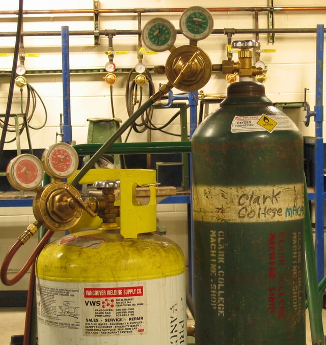 Oxygen and MAPP gas compressed gas cylinders with regulators