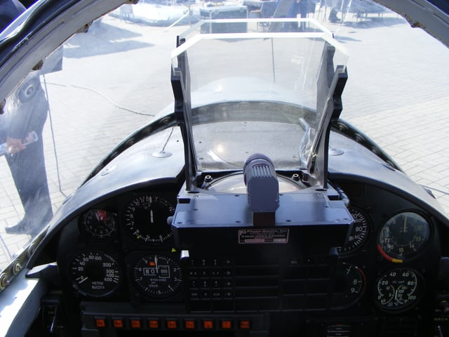 HUD mounted in a PZL TS-11 Iskra jet trainer aircraft with a glass plate combiner and a convex collimating lens just below it
