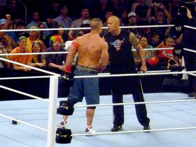 The Rock and John Cena (left) on Raw, agreeing to a match at WrestleMania XXVIII one year in advance