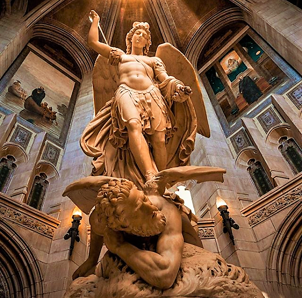 Sculpture of archangel Michael conquering Lucifer.