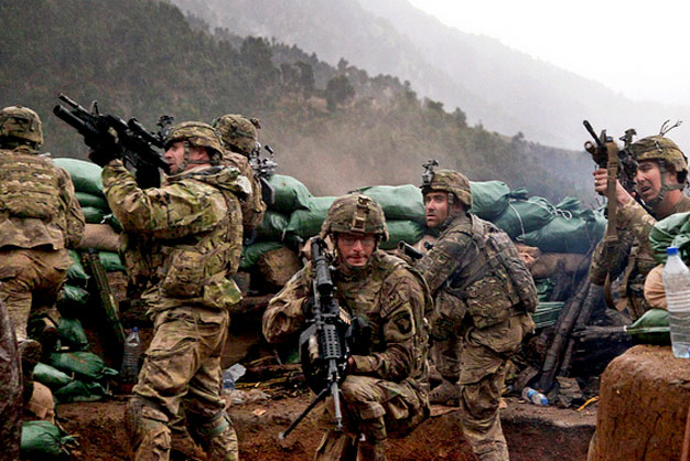 U.S. Army soldiers with 2nd Battalion, 327th Infantry Regiment, 101st Airborne Division return fire during a firefight with Taliban forces in Barawala Kalay Valley in Kunar province, Afghanistan, 31 March 2011.
