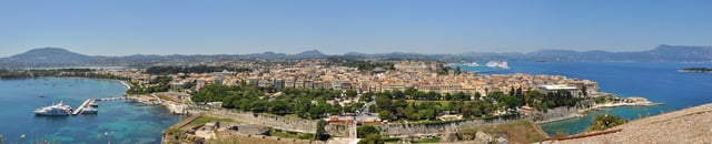 Panoramic view of the old Corfu City, a UNESCO World Heritage Site, as seen from the Old Fortress. The Bay of Garitsa is to the left and the port of Corfu is just visible on the top right. Spianada Square is in the foreground.