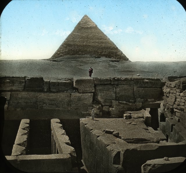 One face of the Pyramid of Khafre in Giza, showing a nearby archaeological site