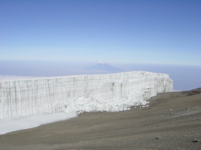 Vertical margin wall of the Rebmann Glacier in 2005 with Mount Meru in the background.