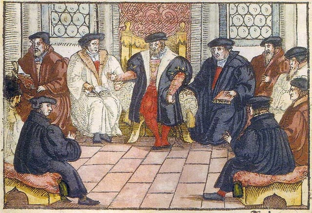 The Marburg Colloquy (1529) was an early attempt at uniting Luther and Zwingli. It failed as both reformers and their delegations could not agree on the sacrament of the Eucharist. Similar discussions were held in 1586 during the Colloquy of Montbéliard and from 1661-1663 during the Syncretistic Controversy. Anonymous woodcut, 1557.
